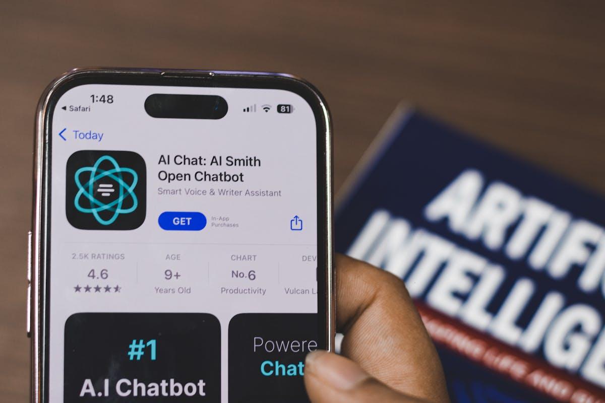 Hand holding smartphone with AI chatbot interface demonstrating AI agents