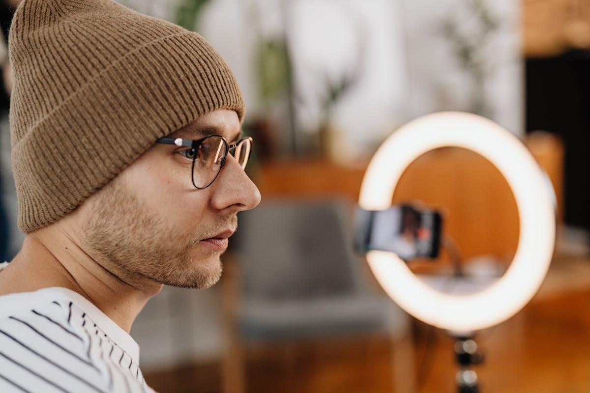 Content creator recording video with ring light