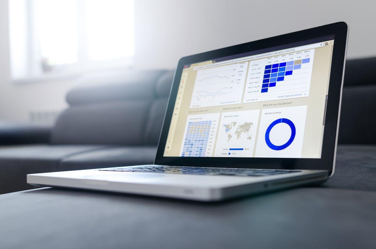 Laptop showcasing data analytics dashboard with graphs