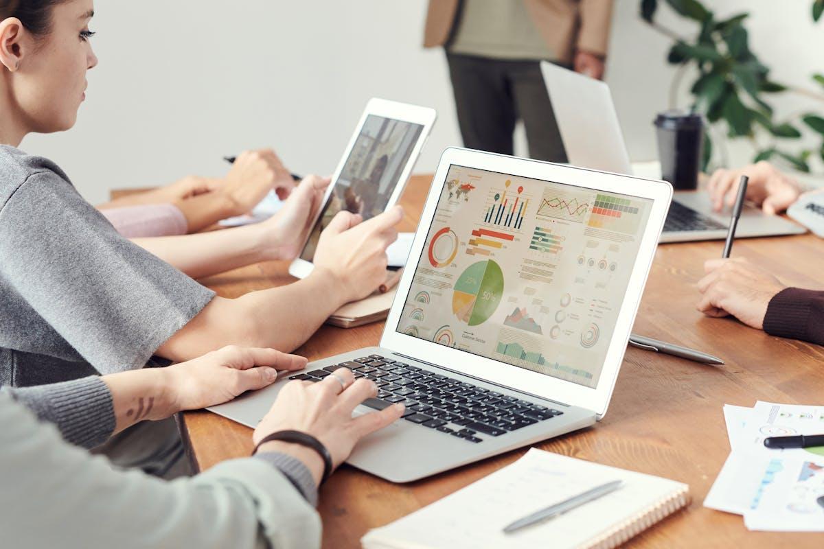 Team analyzing data charts during a collaborative meeting