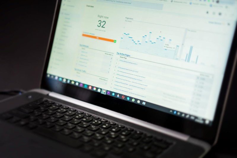 Laptop displaying social media analytics dashboard with real-time data tracking