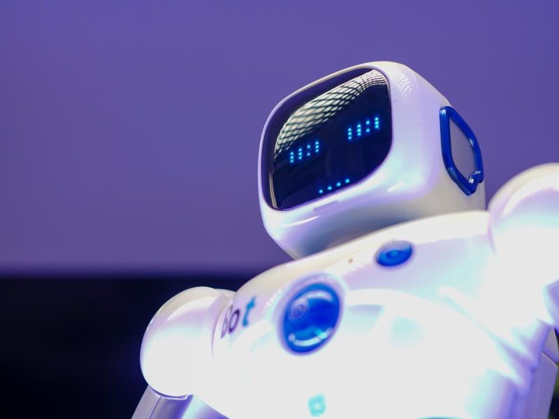 Modern humanoid robot with digital face symbolizing AI-powered trend prediction technology