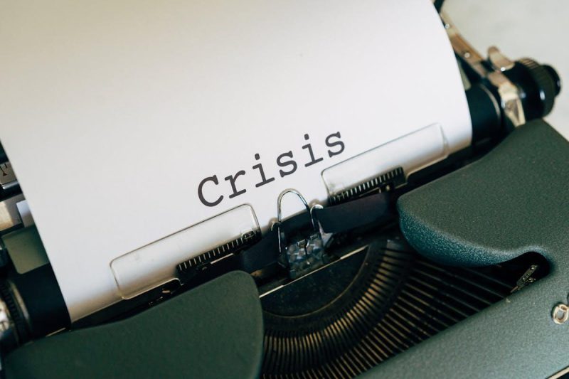 Vintage typewriter with the word Crisis