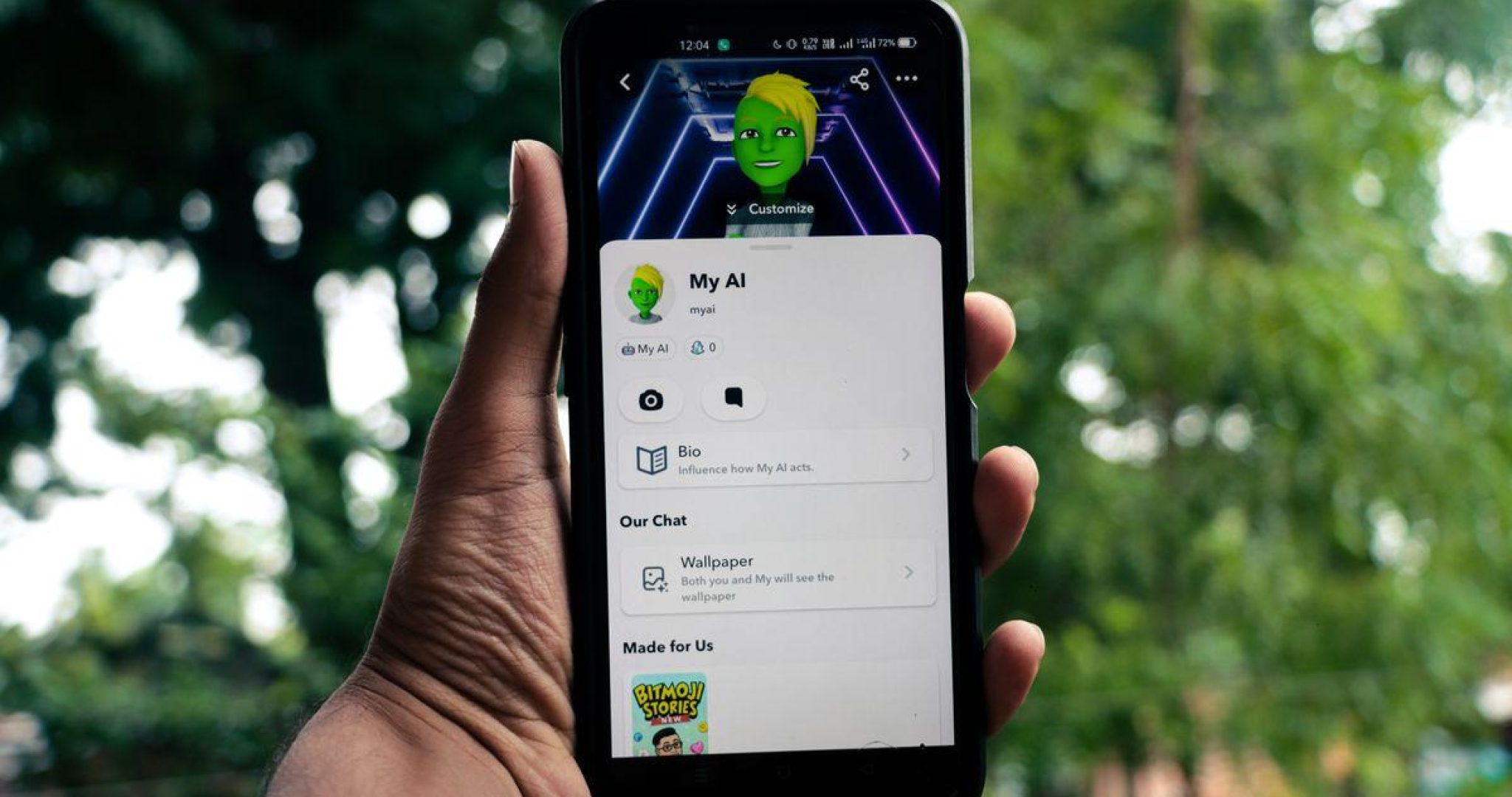 Person holding a smartphone with AI social media application