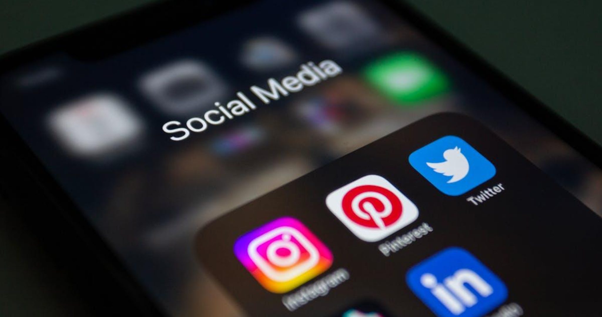 Smartphone displaying social media applications for content monetization