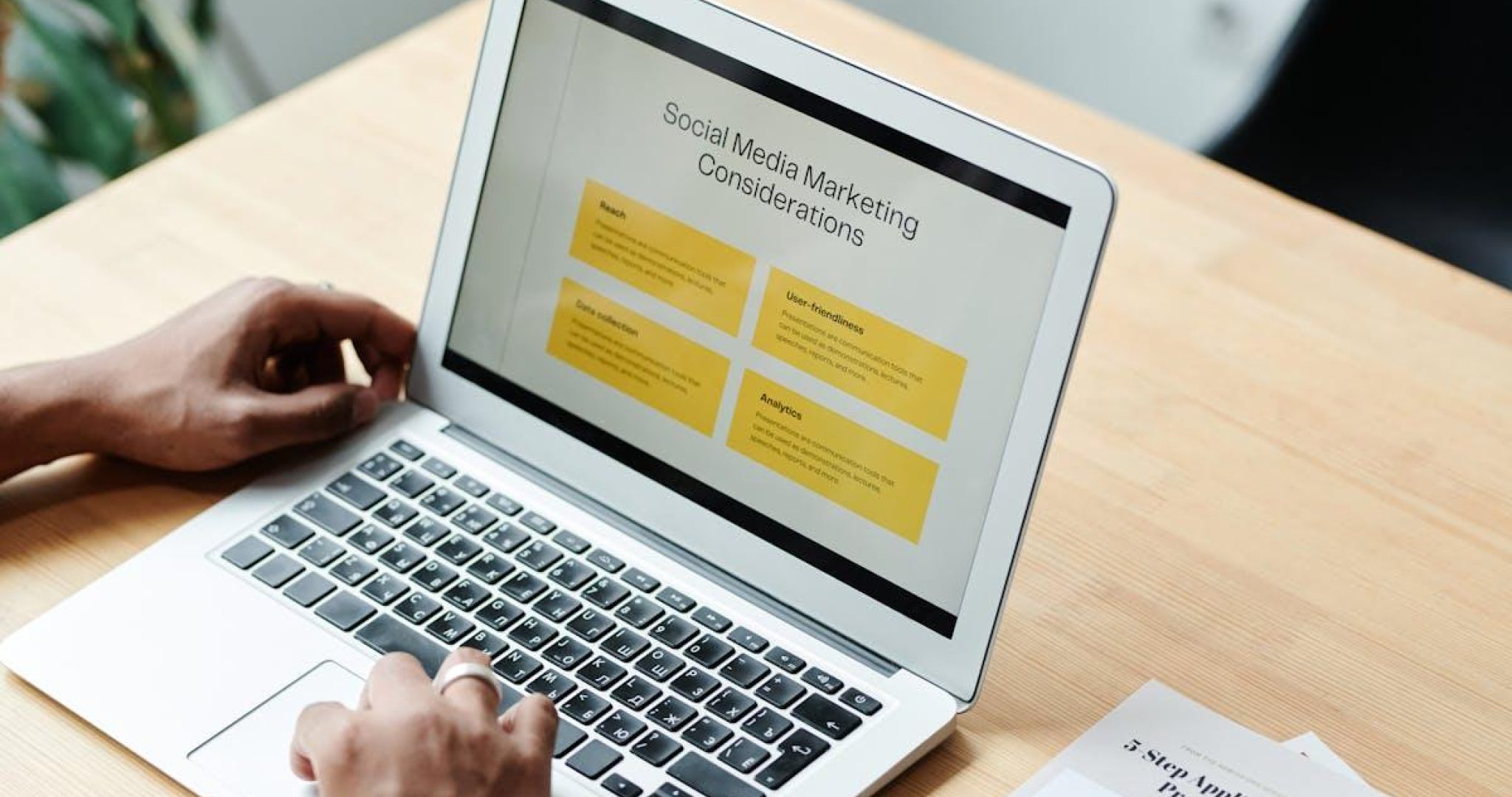 Person reviewing social media marketing strategies on a laptop at home