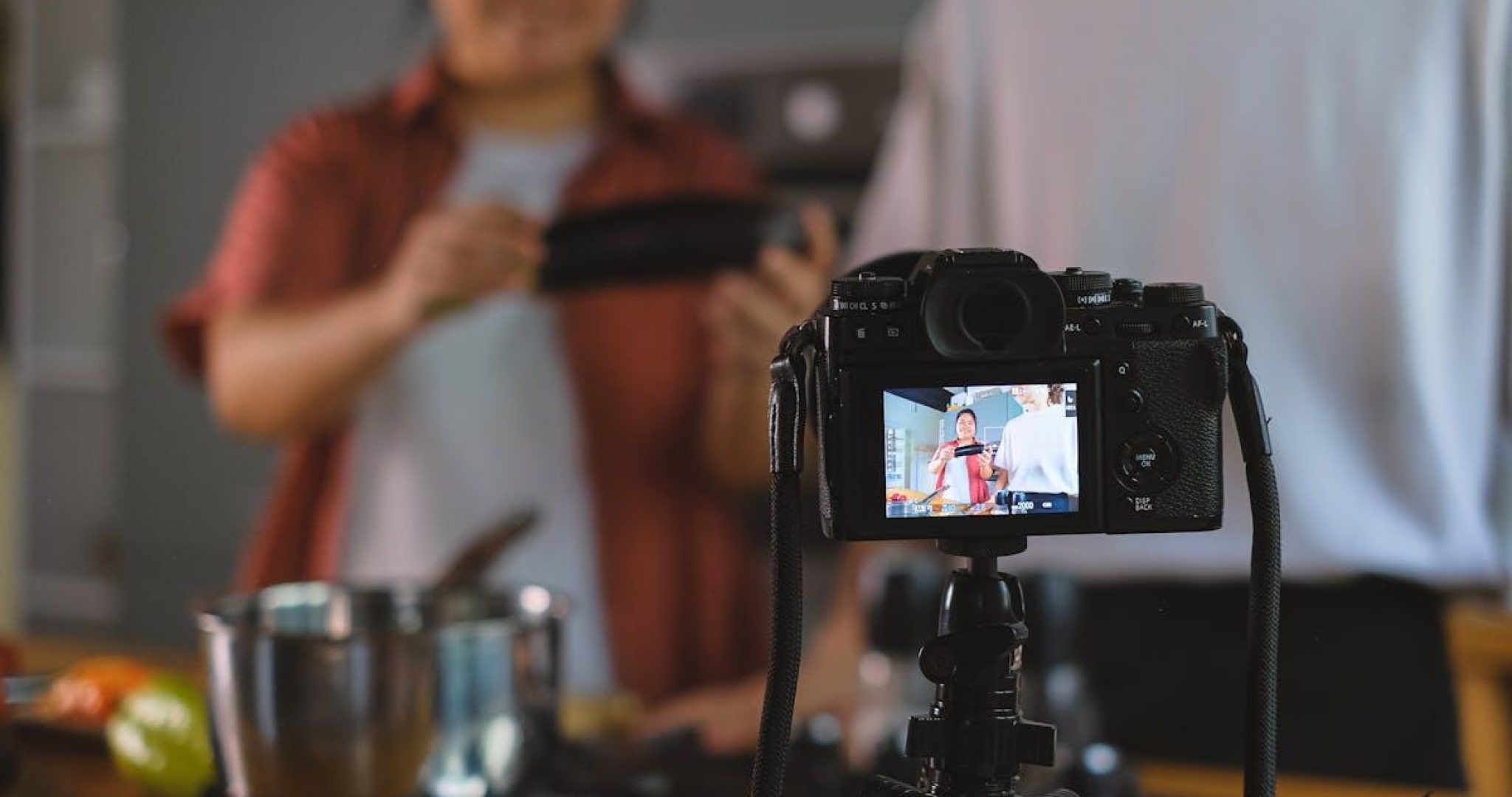 Person setting up smartphone on tripod
