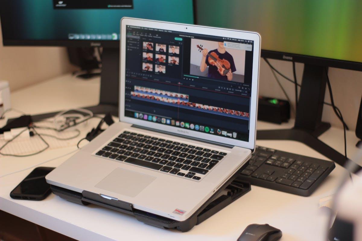 Workspace with laptop showing video editing software for post-production
