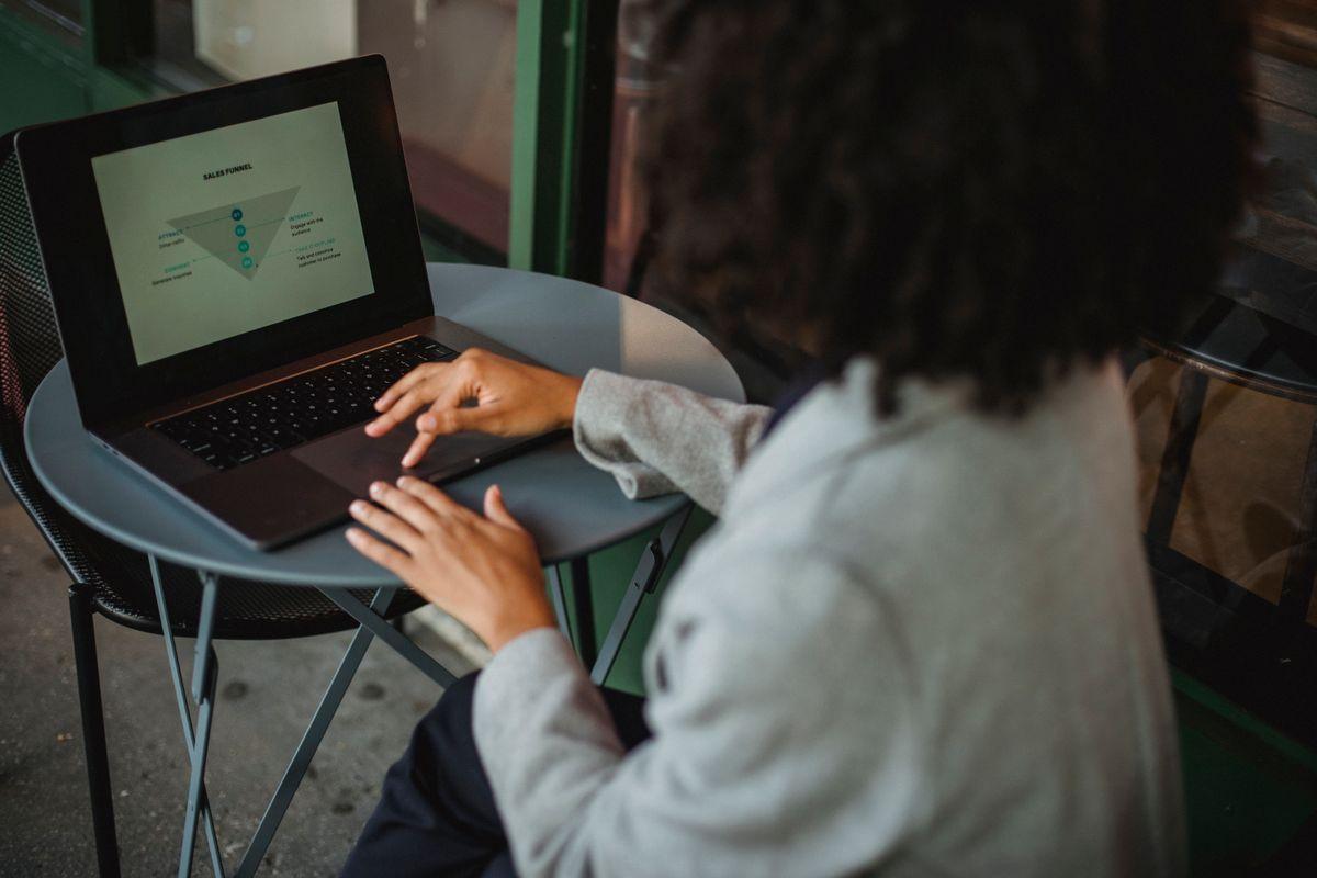 Business owner reviewing AI tool options on laptop