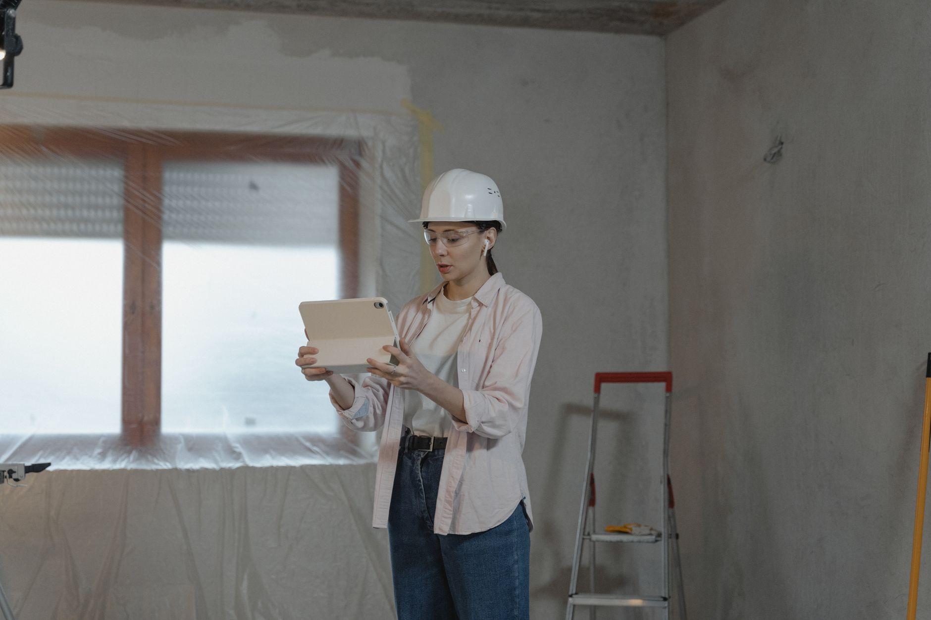 Contractor using a tablet for construction project management