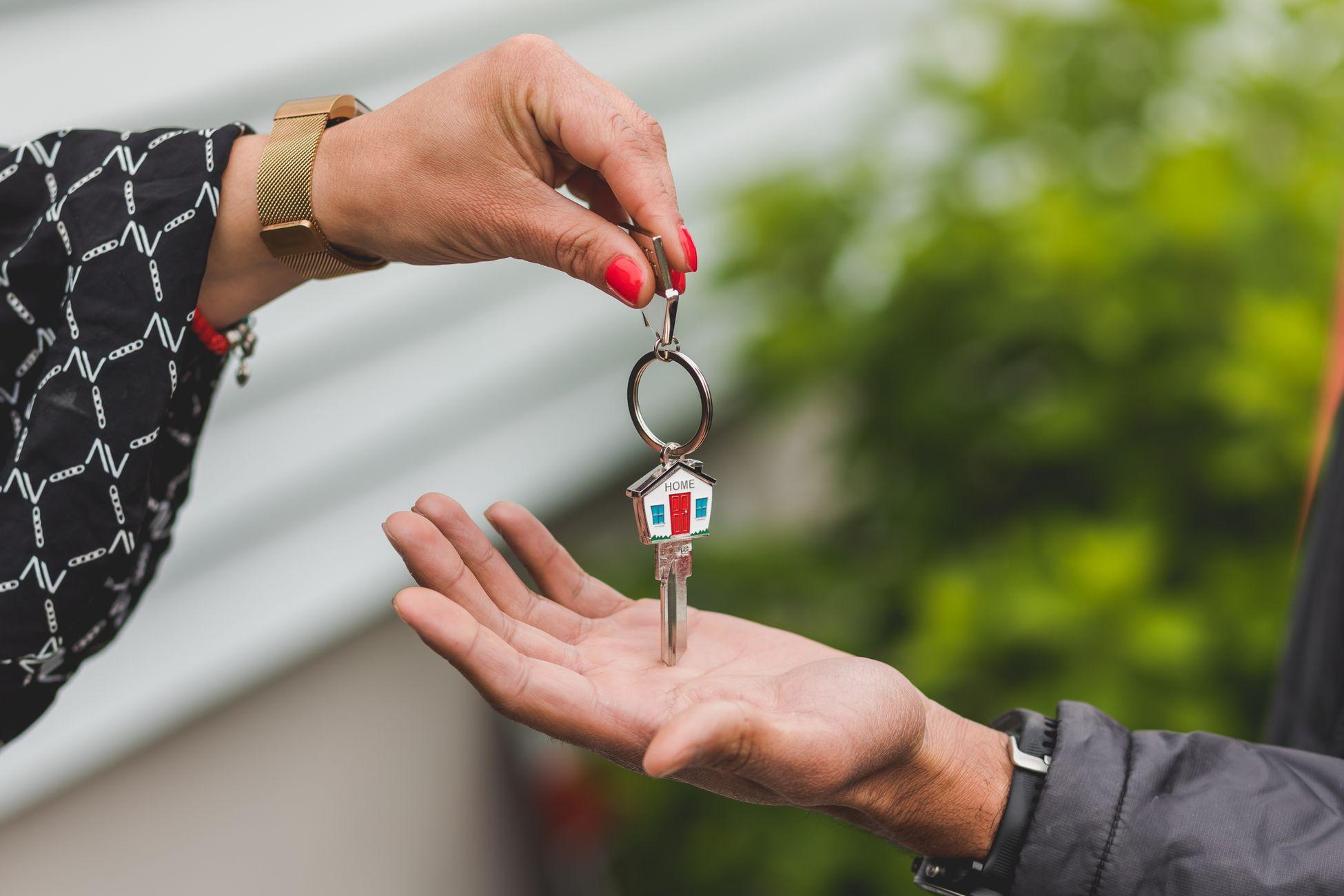 Close-up of real estate key handover