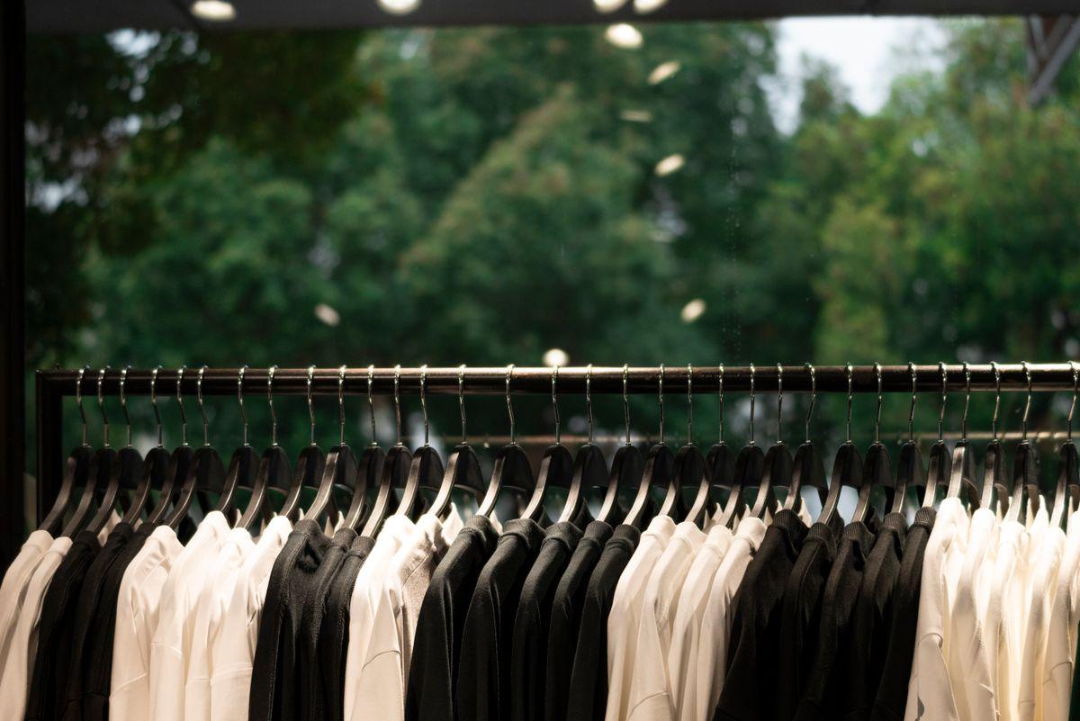 Clothing neatly arranged on racks in a retail store