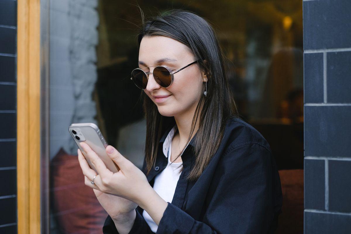 Smartphone showing messaging and social media apps for conversational content management