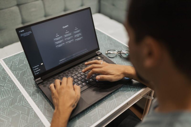 Person using a laptop to interact with AI technology, representing MCP server integration