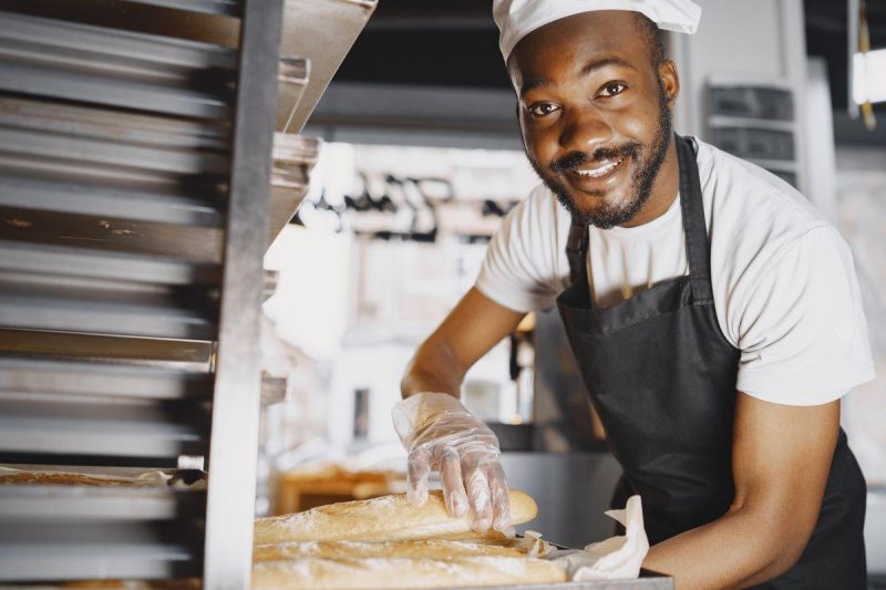 Artisan baker shaping bread dough