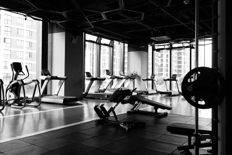 A modern fitness studio with equipment, representing the business side of running a gym