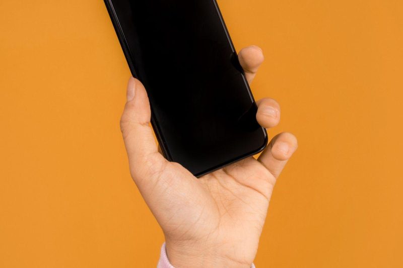 Person recording a vertical video on their smartphone for social media
