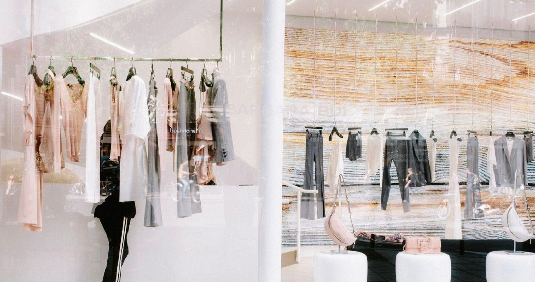 Fashion boutique interior with stylish clothing display on racks