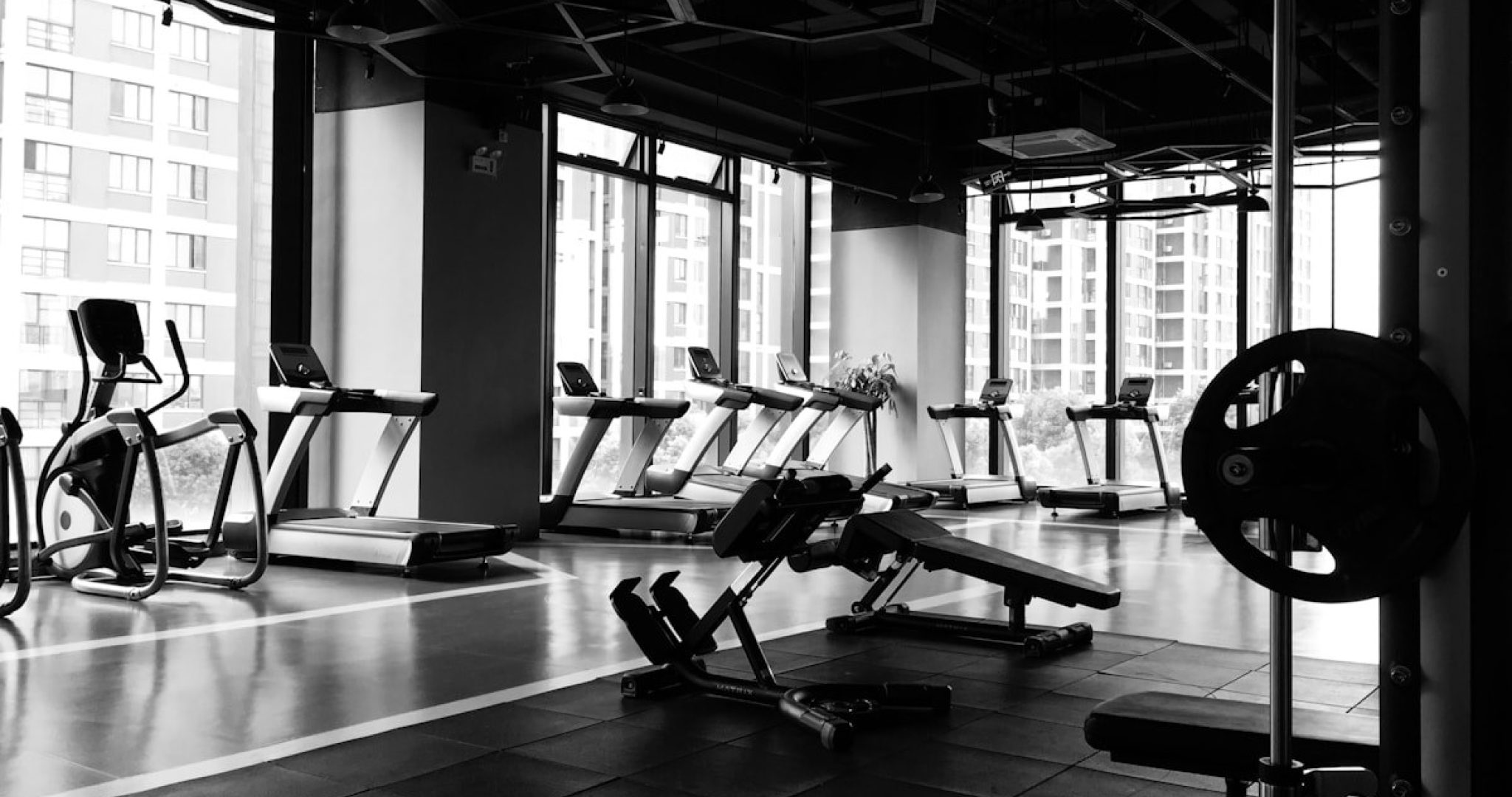 A modern fitness studio with equipment, representing the business side of running a gym