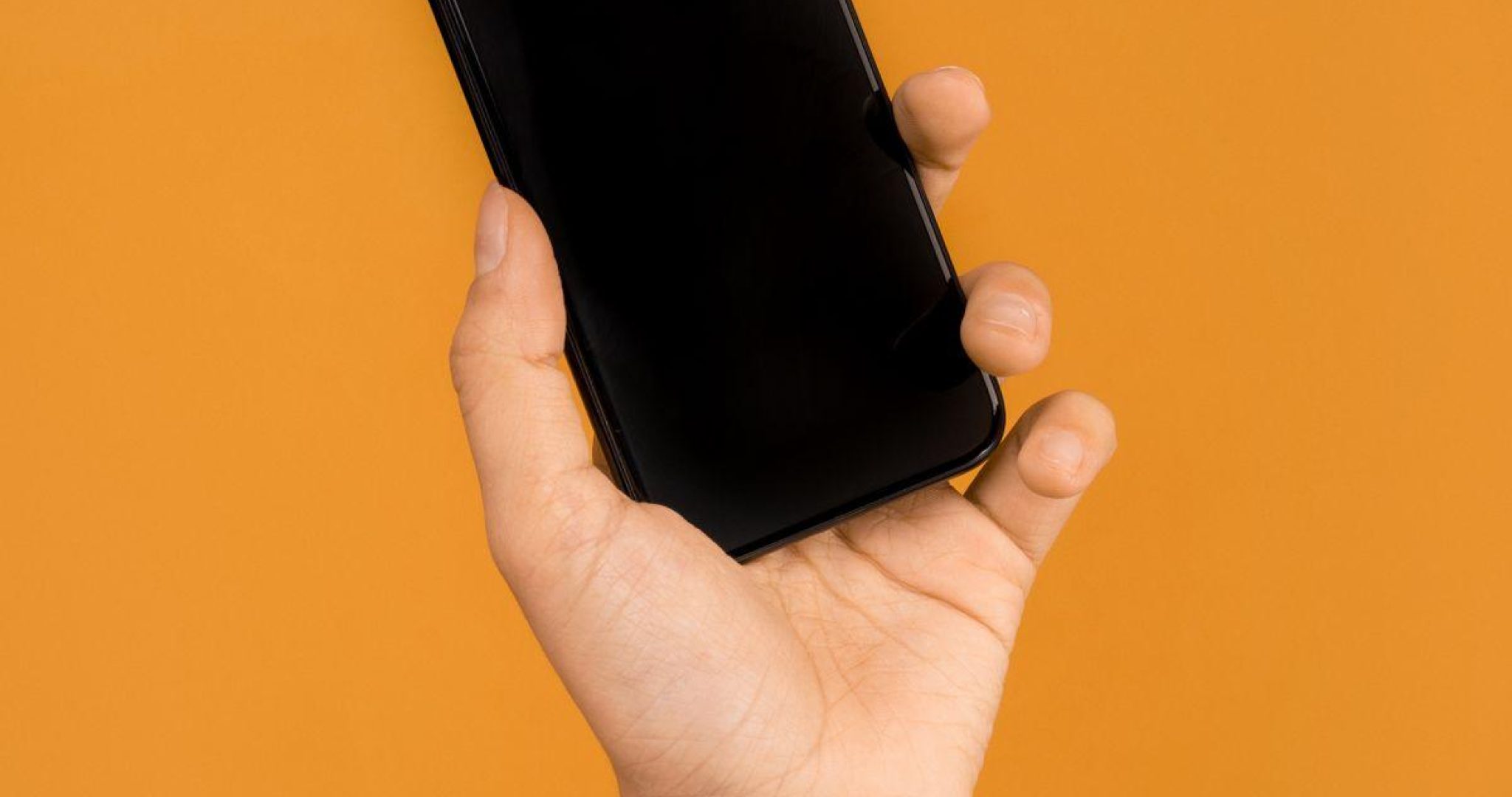 Person recording a vertical video on their smartphone for social media