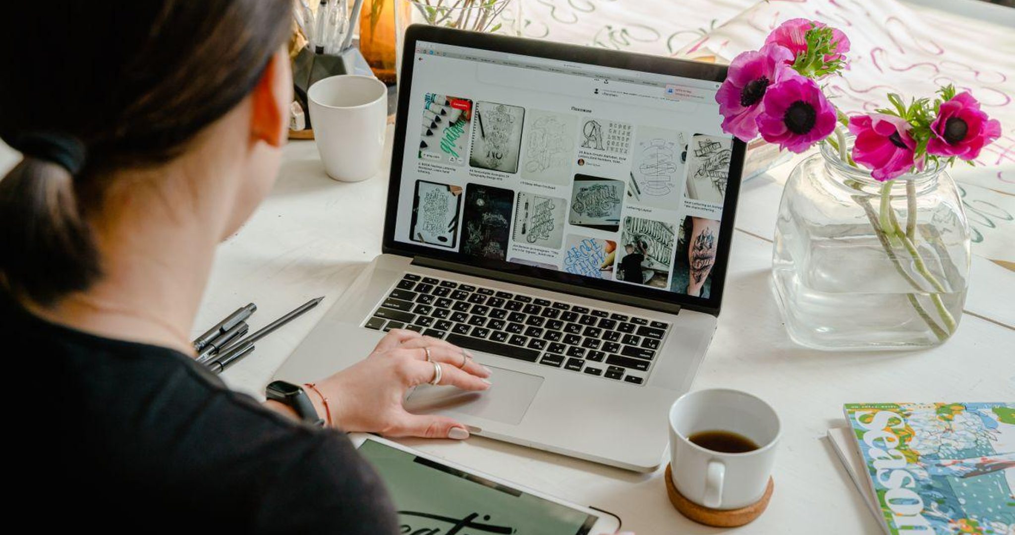 Professional using LinkedIn on a laptop in a modern office setting